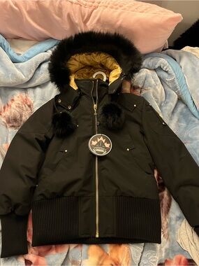 Moose Knuckles Black Kids Puffer Jacket with Gold Lining & Faux Fur Trim